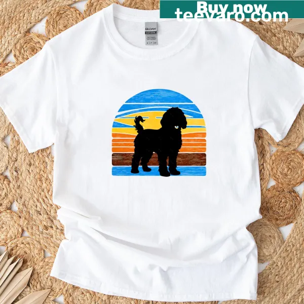 Silhouette of a Goldendoodle against a vintage sunset background