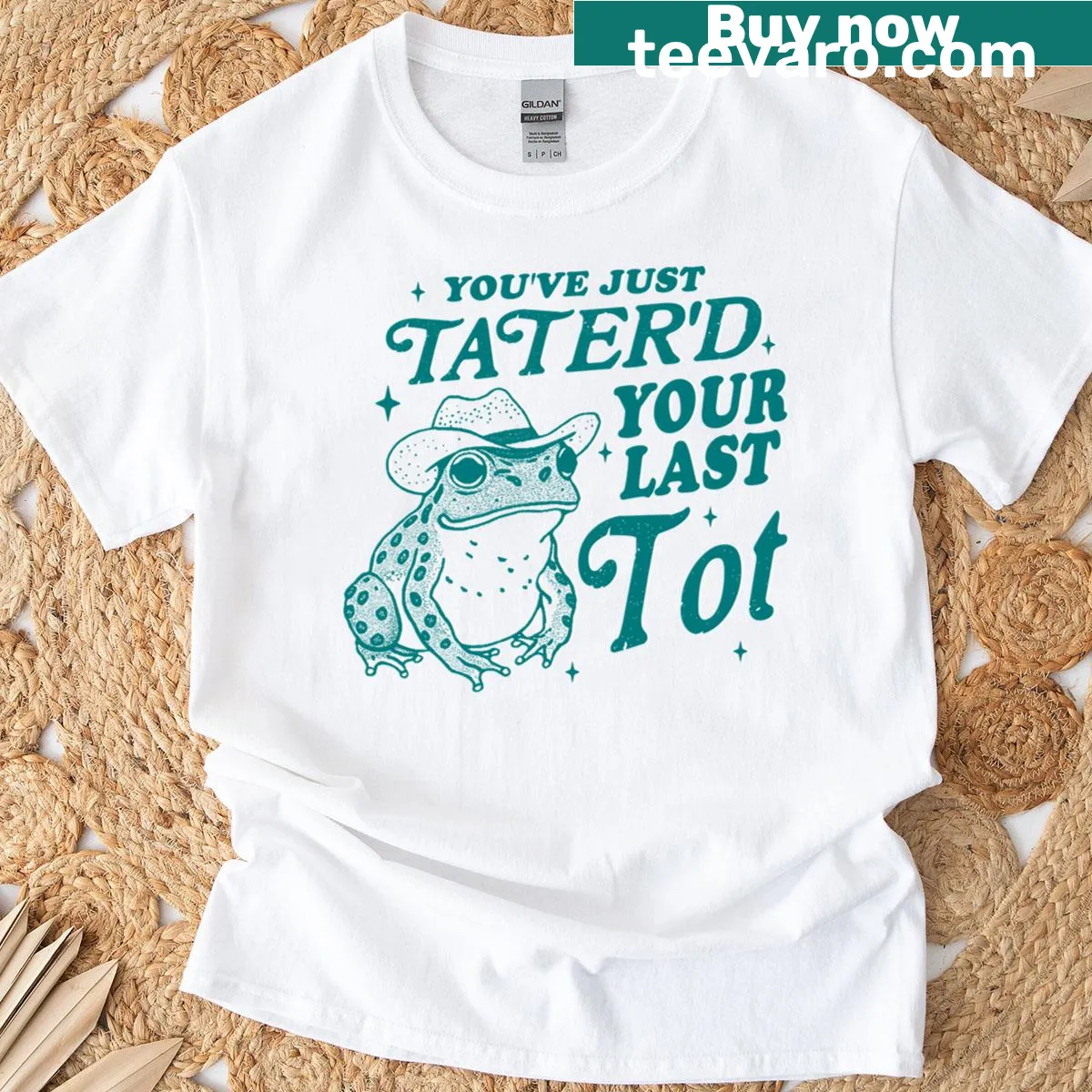 Funny cartoon T-shirt featuring a cowboy frog and tater tot joke — on a men's t-shirt