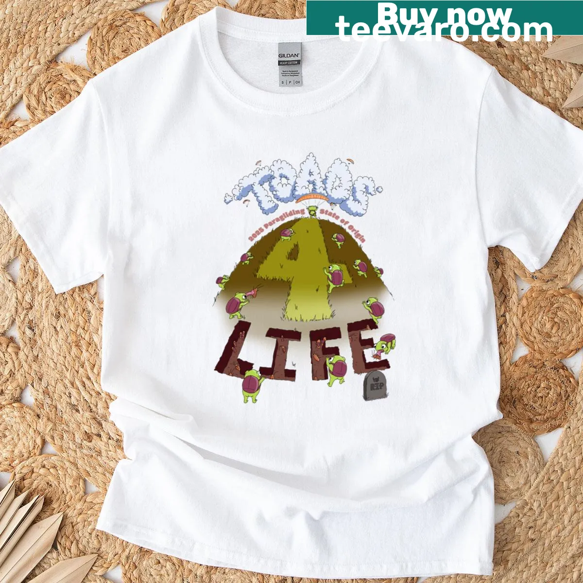 T-shirt featuring Queensland Cane Toads and paragliding imagery — on a men's t-shirt