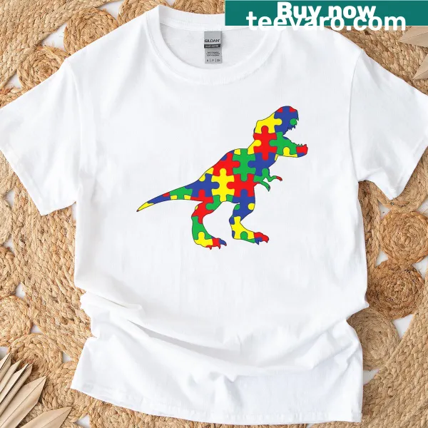 Cute cartoon dinosaur design promoting autism awareness on a t-shirt