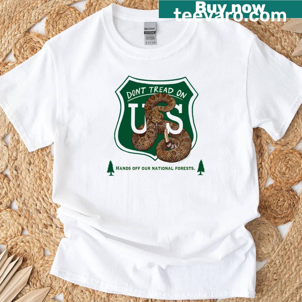 Patriotic t-shirt with rattlesnake emblem and national forests message — on a men's t-shirt