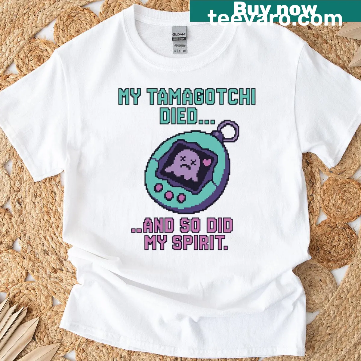 Illustration of a Tamagotchi with humorous text about it dying on a T-shirt. — on a men's t-shirt