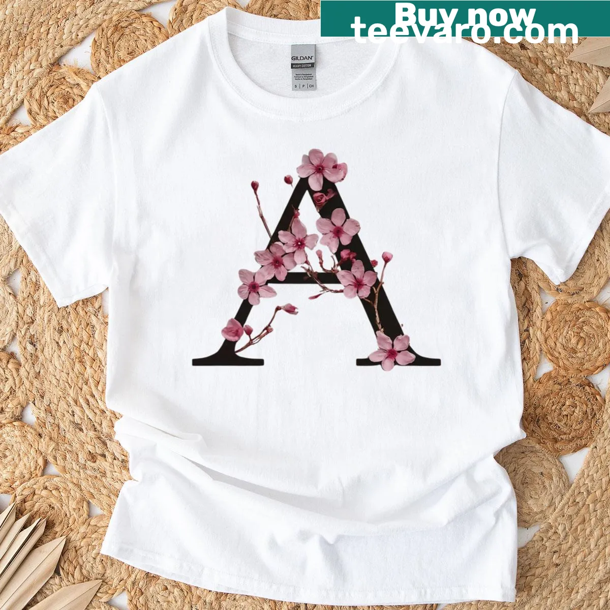 Floral letter A design with cherry blossoms on a t-shirt — on a men's t-shirt