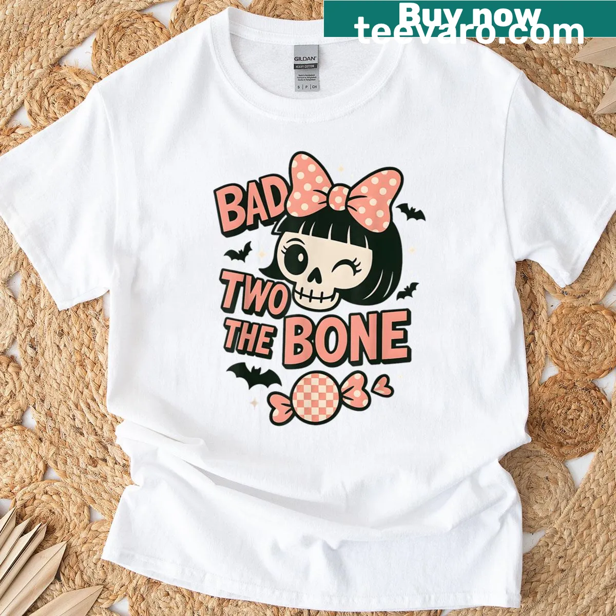 Skull graphic with a pink bow, designed for Halloween — on a men's t-shirt