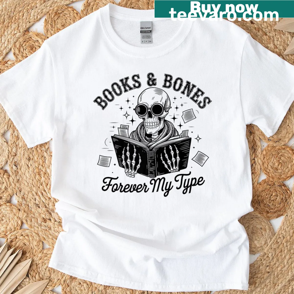 Skull graphic t-shirt with books and bones theme — on a men's t-shirt