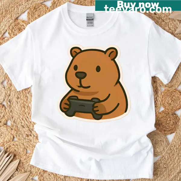 Cartoon-style t-shirt featuring a cute capybara with gaming elements