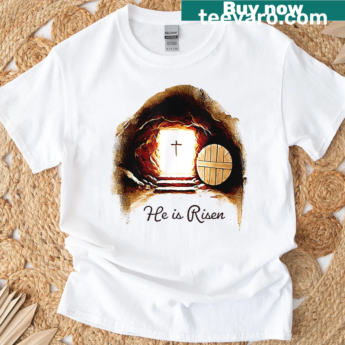 Easter shirt with 'He Is Risen' and an empty tomb illustration — on a men's t-shirt