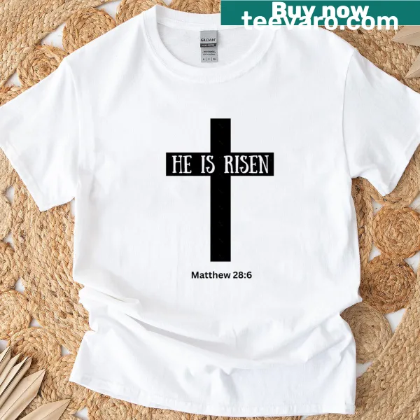 Minimalist t-shirt with a cross and the phrase 'He Is Risen'