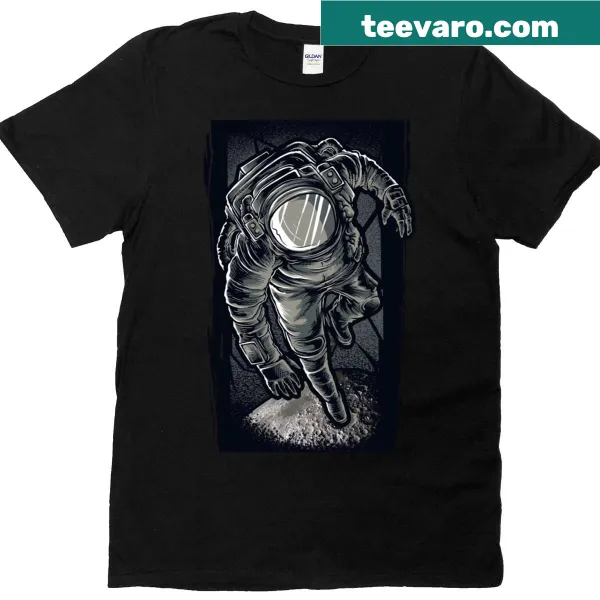 T-shirt featuring a whimsical astronaut floating in space, napping.