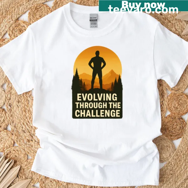 Inspirational typography stating 'Evolving Through The Challenge' on a T-shirt
