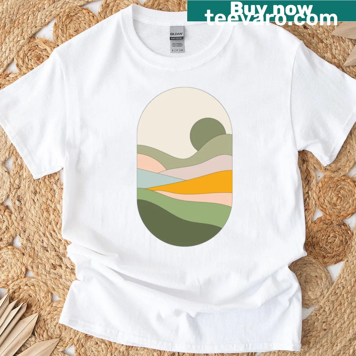 Illustrated t-shirt featuring a golden valley landscape design — on a men's t-shirt