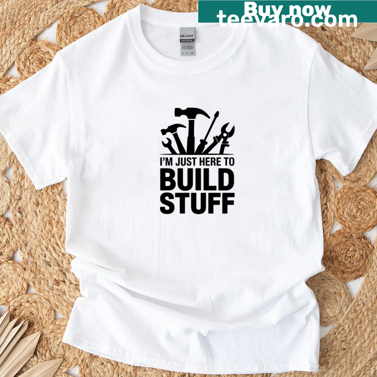Bold typography t-shirt with the phrase 'I'm Just Here To Build Stuff' — on a men's t-shirt