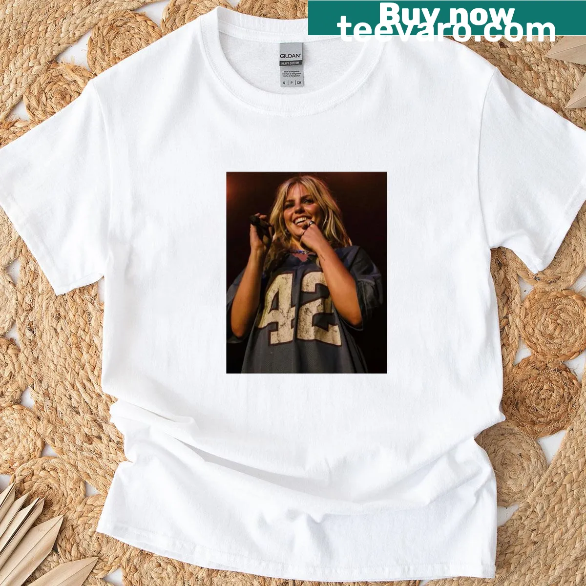 Graphic T-shirt featuring a smirking Renee Rapp. — on a men's t-shirt