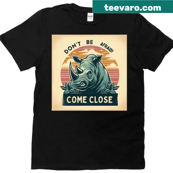 T-shirt featuring a bold rhino graphic with daring text