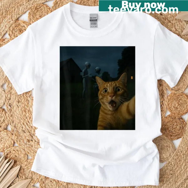 Funny T-shirt with cat selfie alongside aliens