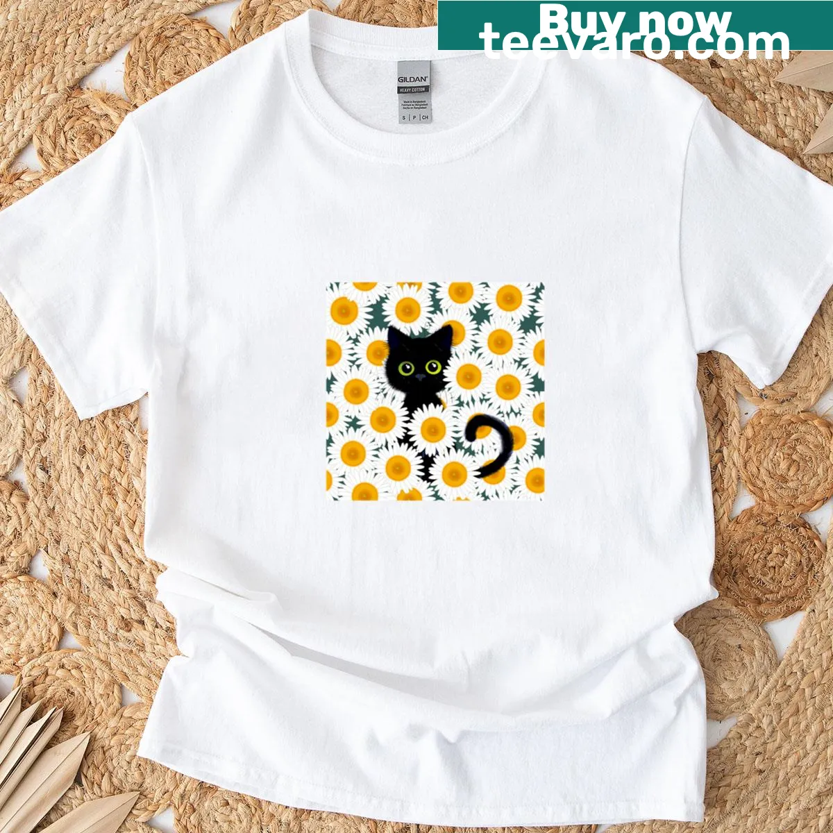 Black cat surrounded by daisies on T-shirt design — on a men's t-shirt