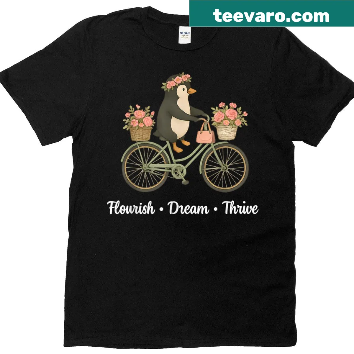 Playful penguin riding a floral bike graphic T-shirt — on a men's t-shirt