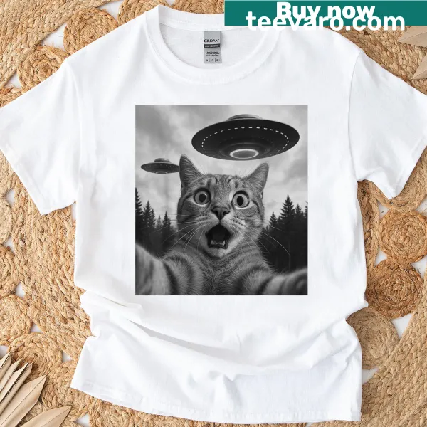Cat selfie graphic with UFOs on a humorous t-shirt