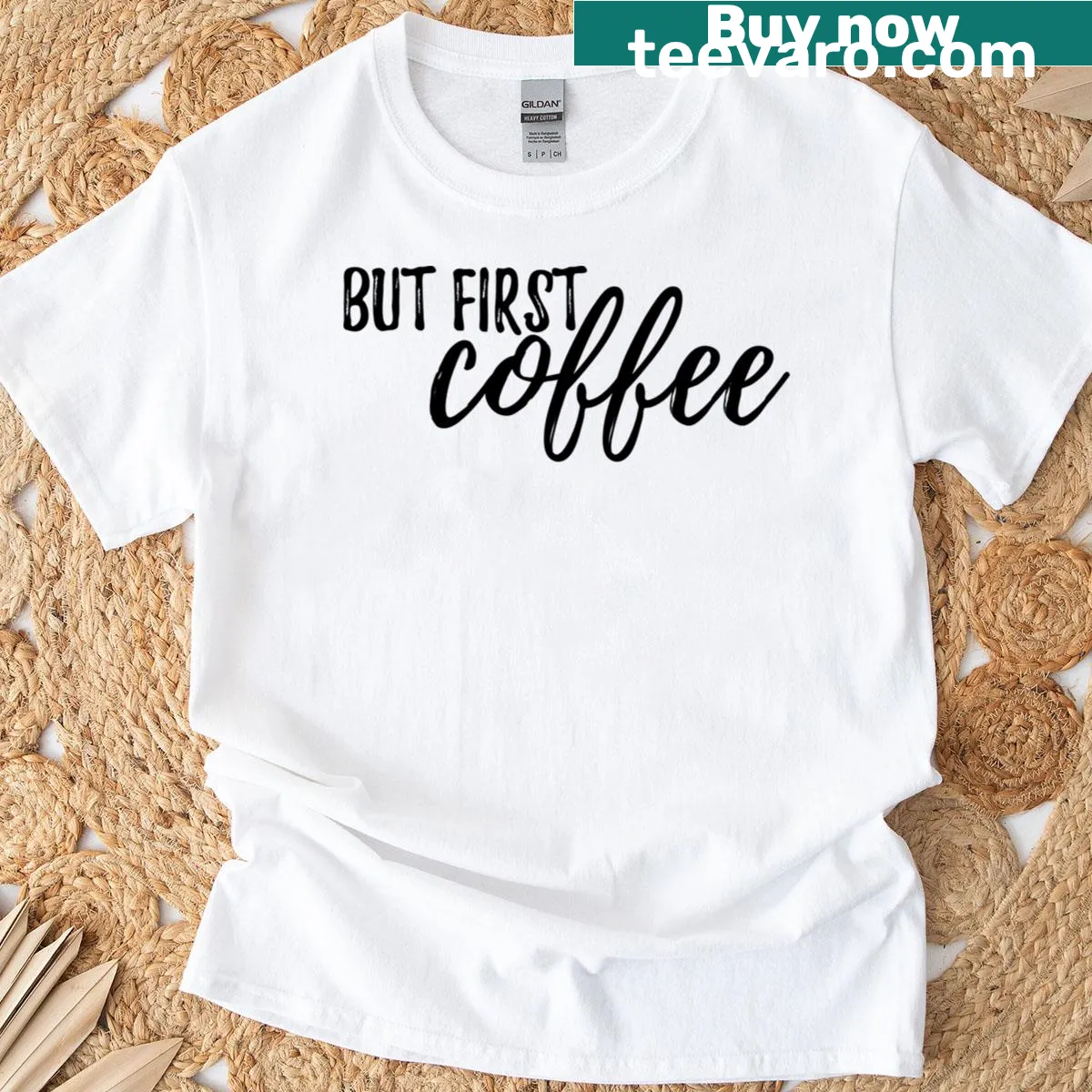 Text 'But First Coffee' printed on a T-shirt — on a men's t-shirt