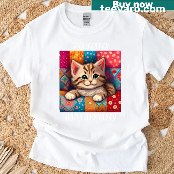 Graphic t-shirt featuring a humorous message about dog hair and quilts.