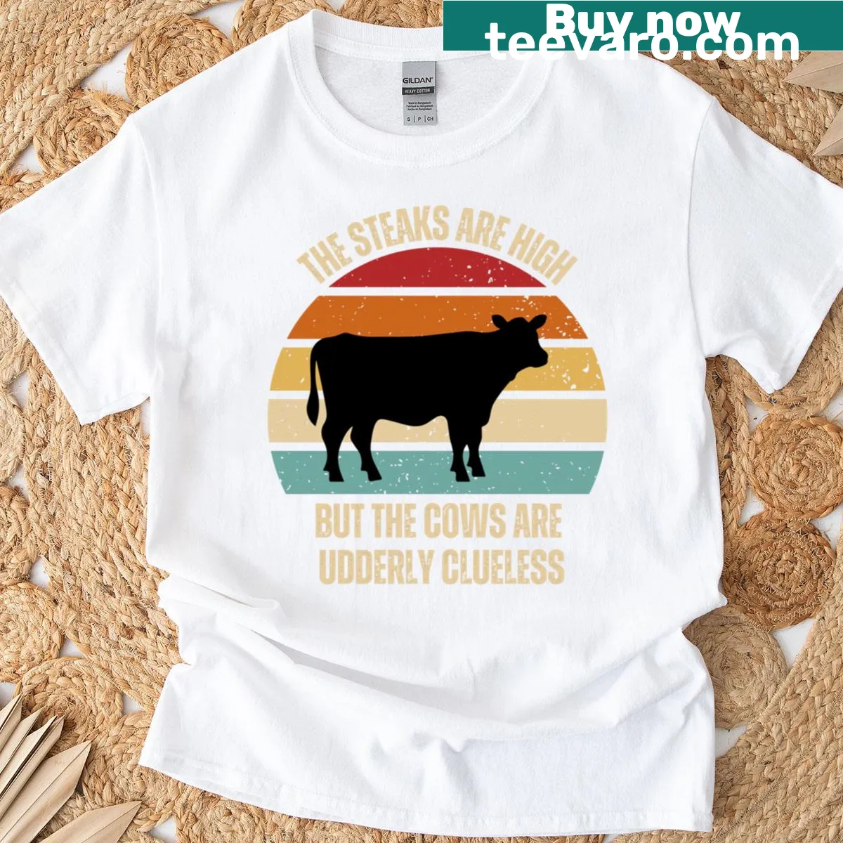 Retro T-shirt featuring a cow silhouette against a sunset. — on a men's t-shirt