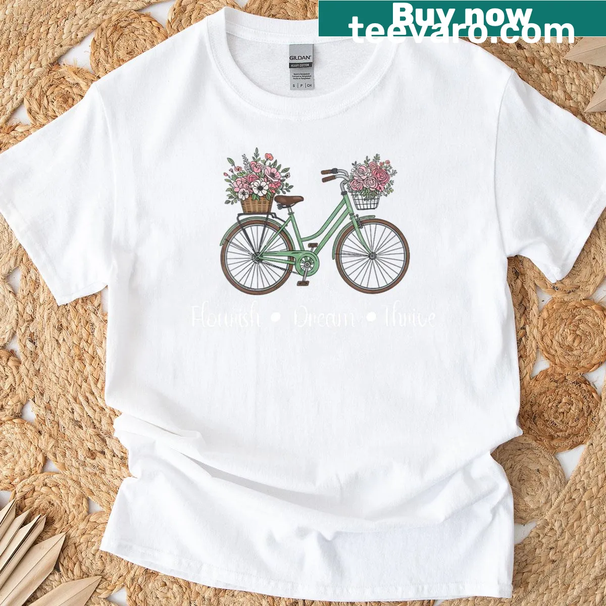 Inspirational floral bike graphic T-shirt with uplifting text — on a men's t-shirt