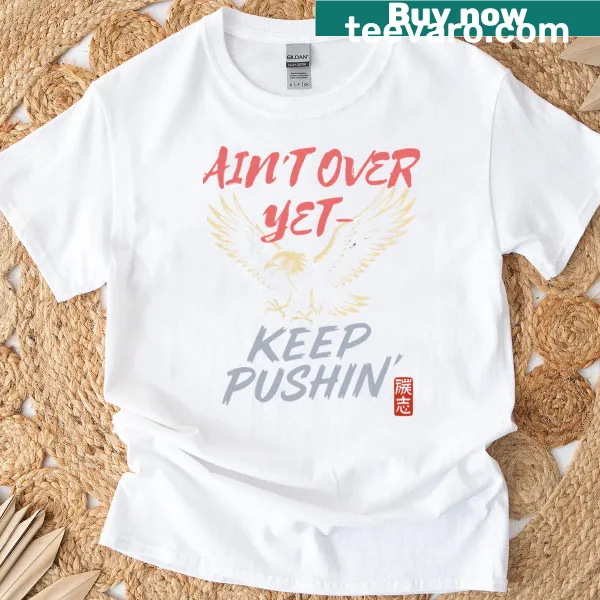 Eagle graphic T-shirt with bold typography stating 'Aint Over Yet'