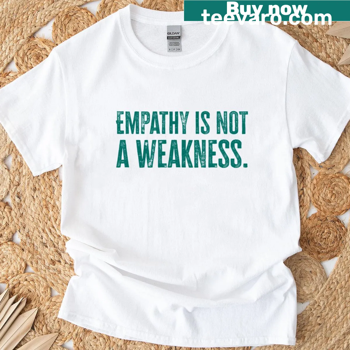 T-shirt featuring an illustrated peacock and the phrase 'Empathy Is Not A Weakness.' — on a men's t-shirt