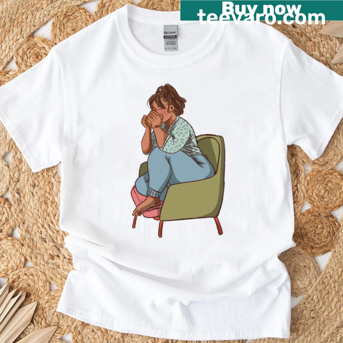 Illustration of a woman drinking coffee on a green chair — on a men's t-shirt