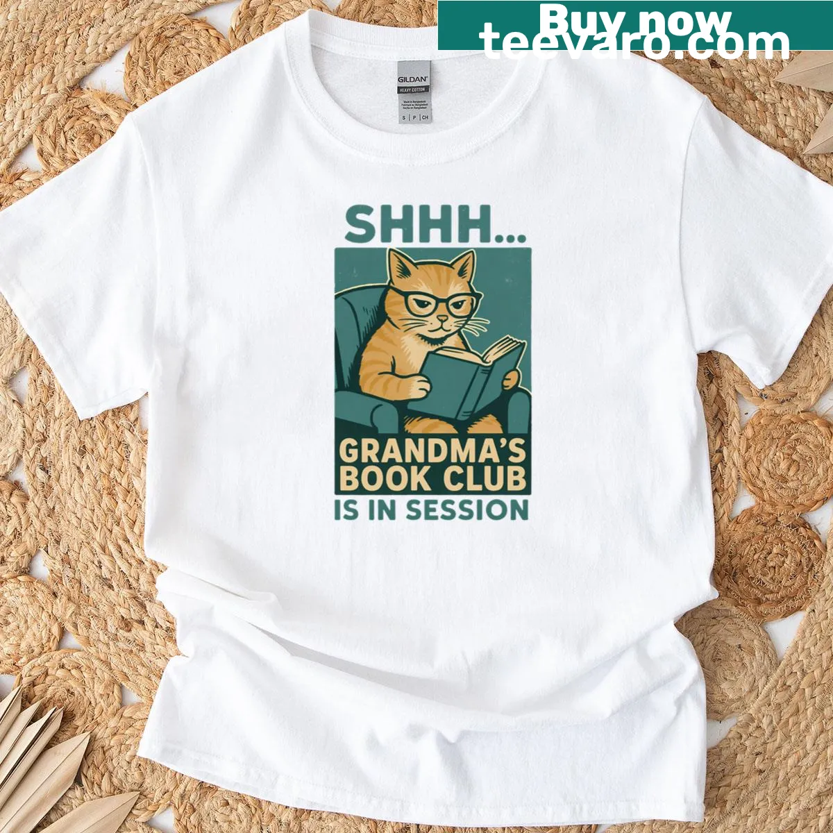 Illustration of a cat with books on a t-shirt — on a men's t-shirt