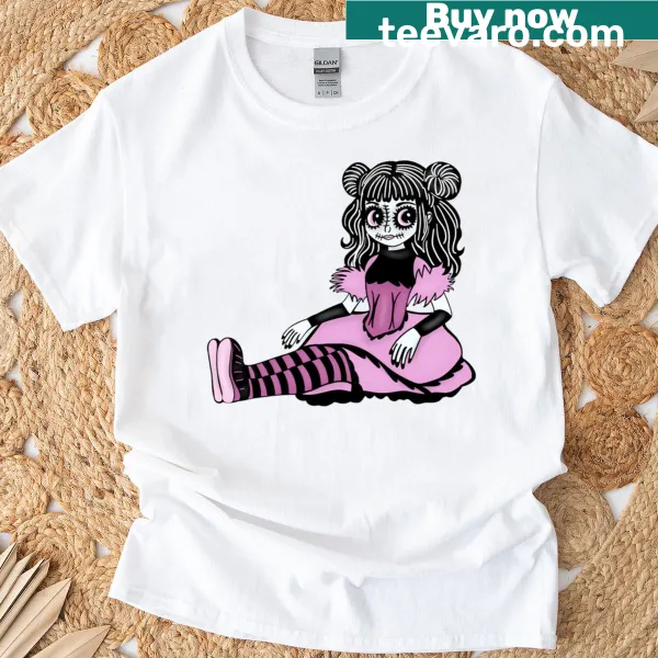 Illustrated witch doll T-shirt featuring a humorous design with pink vibes