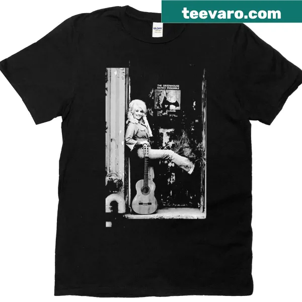 T-shirt featuring an illustration of Dolly Parton playing guitar.