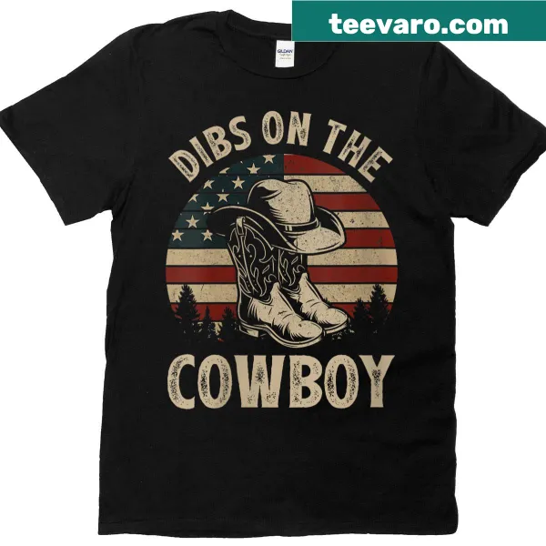 Vintage graphic t-shirt with cowboy boots, hat, and country flag design