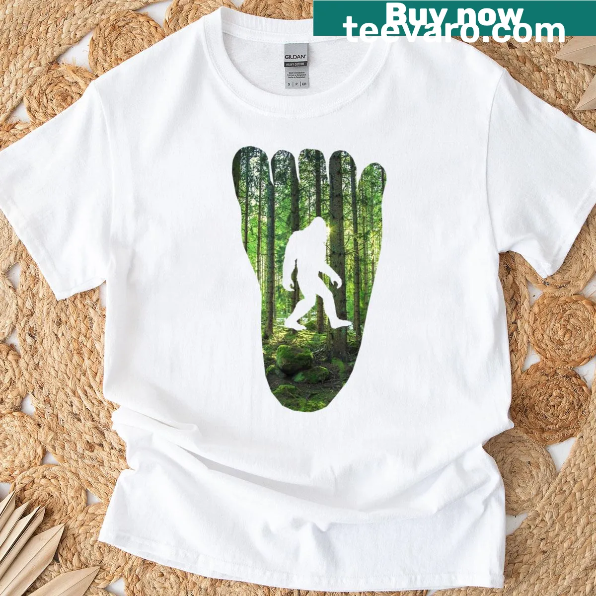 Bigfoot track graphic on a nature-themed T-shirt — on a men's t-shirt