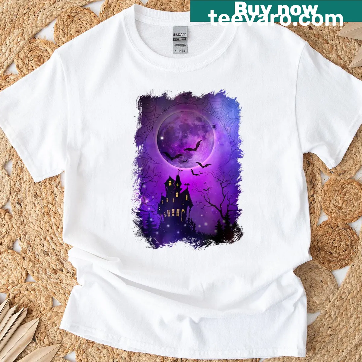 Haunted house and bats graphic under a blood moon for Halloween — on a men's t-shirt
