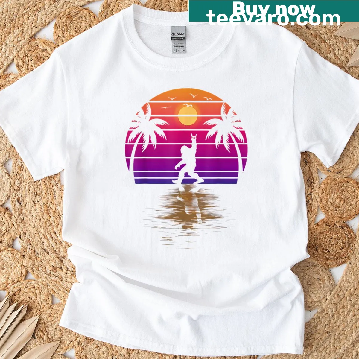 Illustration of a Bigfoot on a Hawaiian beach with palm trees and sunset — on a men's t-shirt