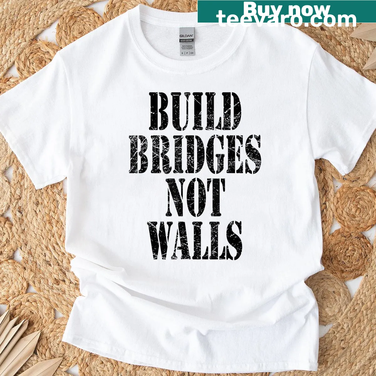 Vintage distressed Christian T-shirt with Build Bridges Not Walls text — on a men's t-shirt