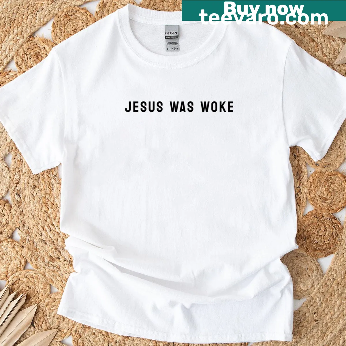 Minimalist T-shirt with the phrase 'Jesus Was Woke' in white text — on a men's t-shirt