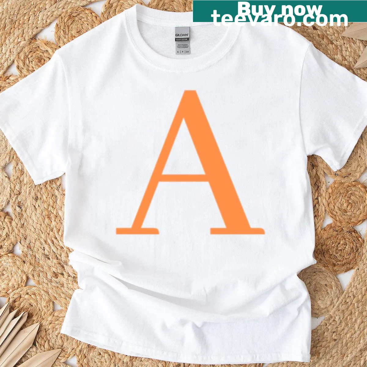 Bold A initial printed on an orange t-shirt — on a men's t-shirt
