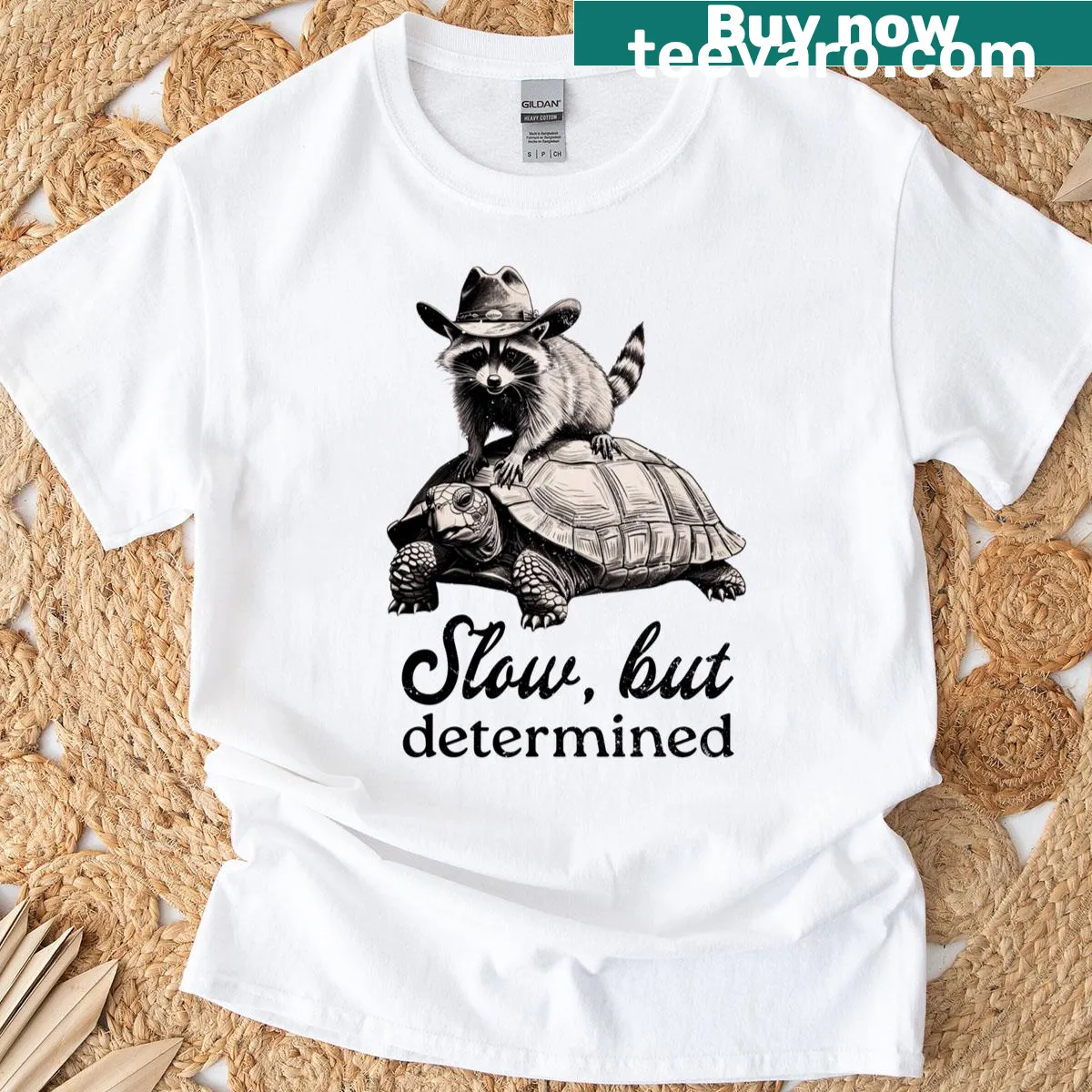 Funny t-shirt featuring a raccoon quote about being slow but determined. — on a men's t-shirt