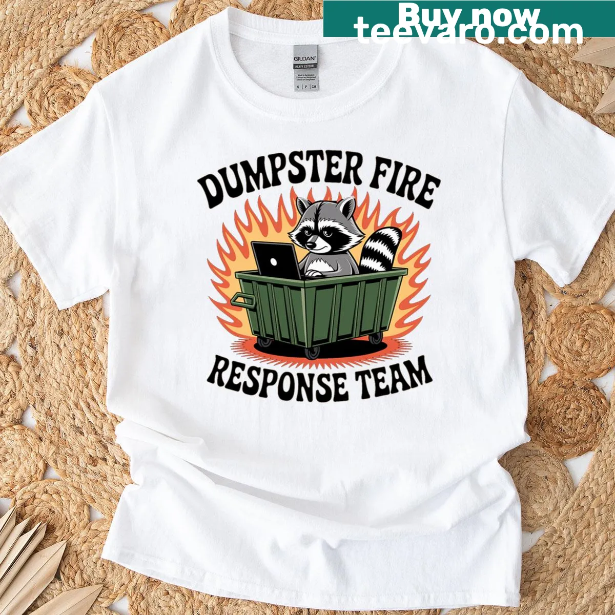 Cartoon raccoon with dumpster fire and humorous text on t-shirt — on a men's t-shirt