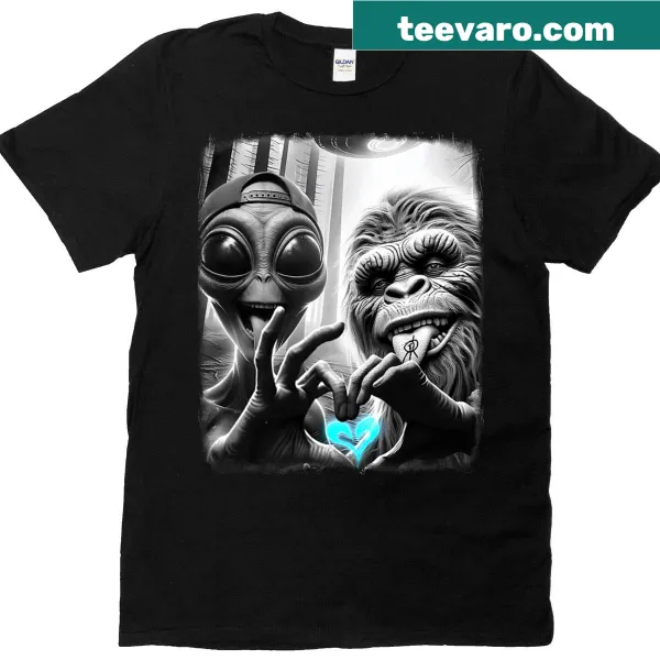 Playful T-shirt featuring Bigfoot and alien love sign graphic