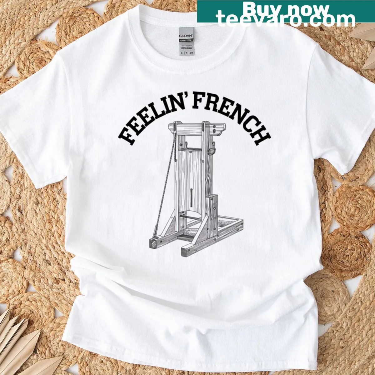 Vintage-style graphic tee with a whimsical guillotine illustration — on a men's t-shirt