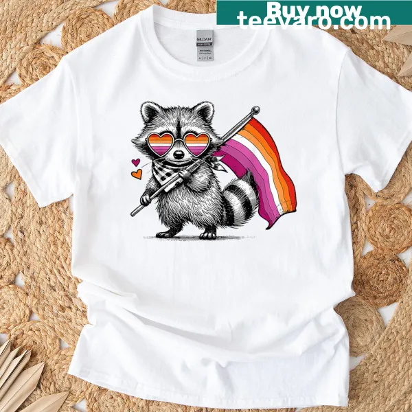 Cute raccoon holding a pride flag on T-shirt
