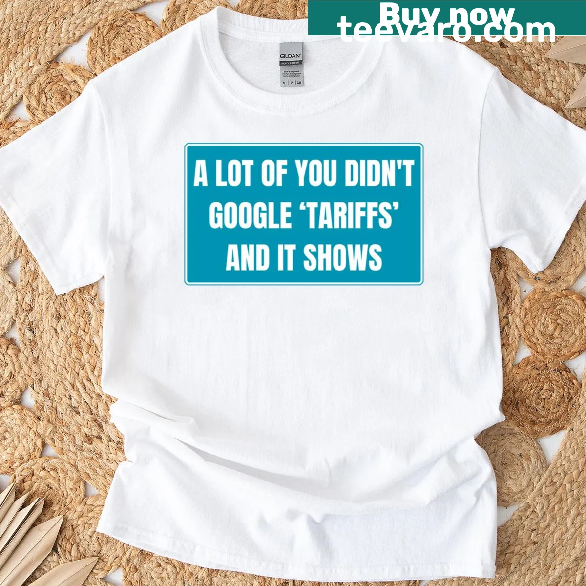 Witty typography on a t-shirt critiquing tariffs and Trump — on a men's t-shirt