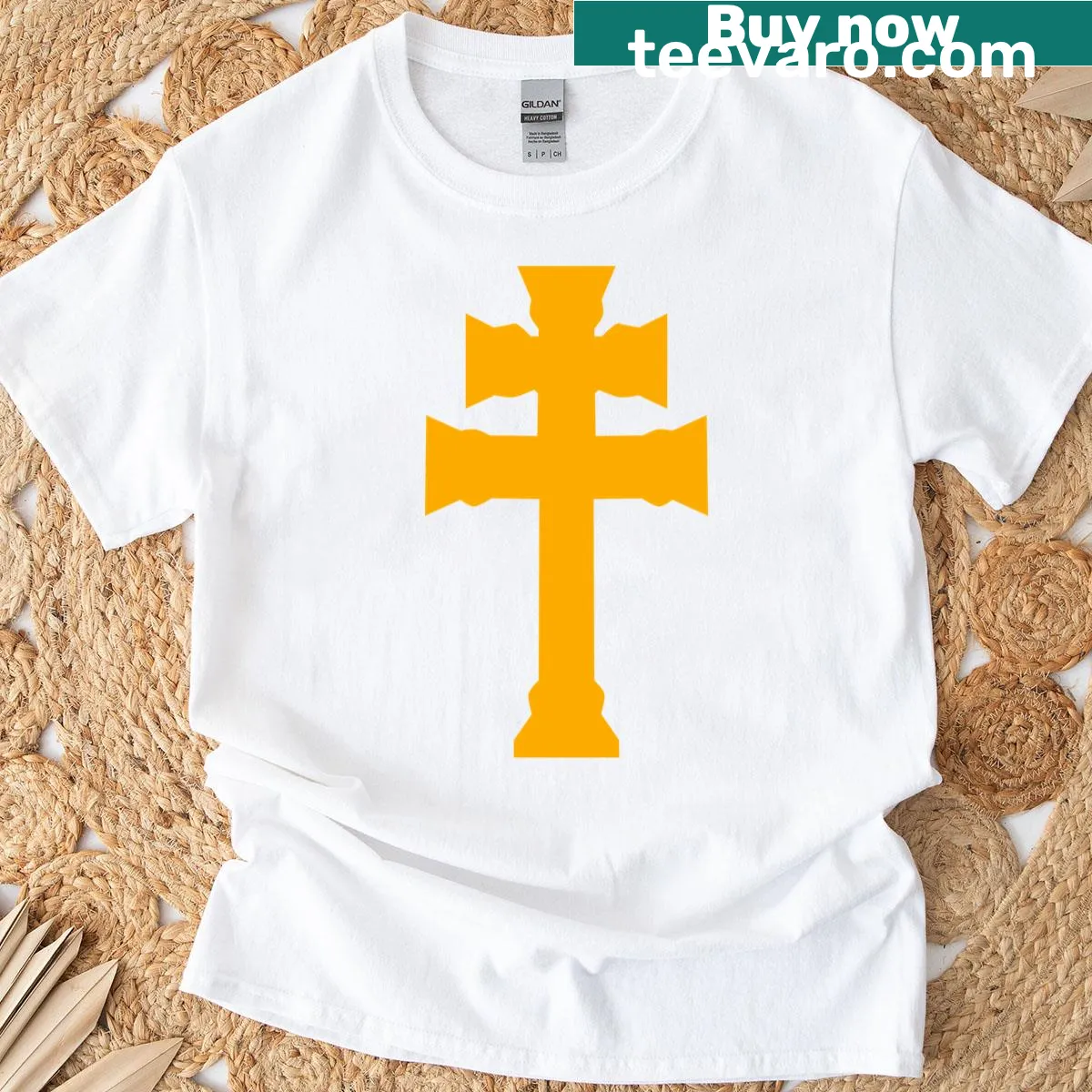 Gold cross design on a white T-shirt — on a men's t-shirt