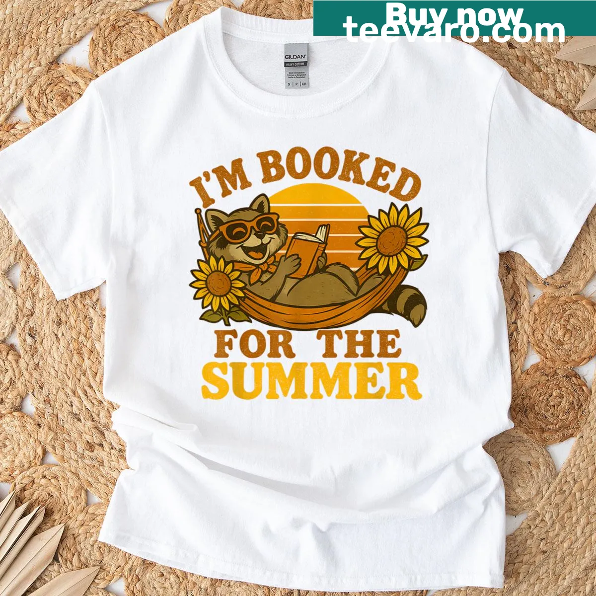 Retro raccoon reading a book on a playful graphic T-shirt — on a men's t-shirt