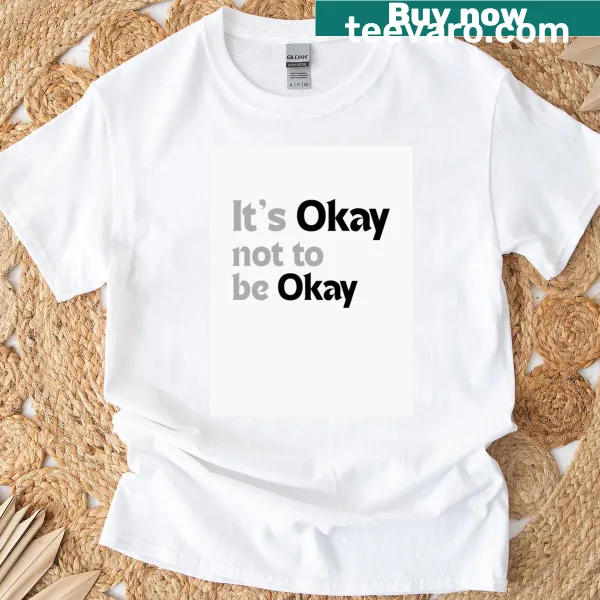 T-shirt featuring the phrase 'It's Okay Not To Be Okay' in simple typography