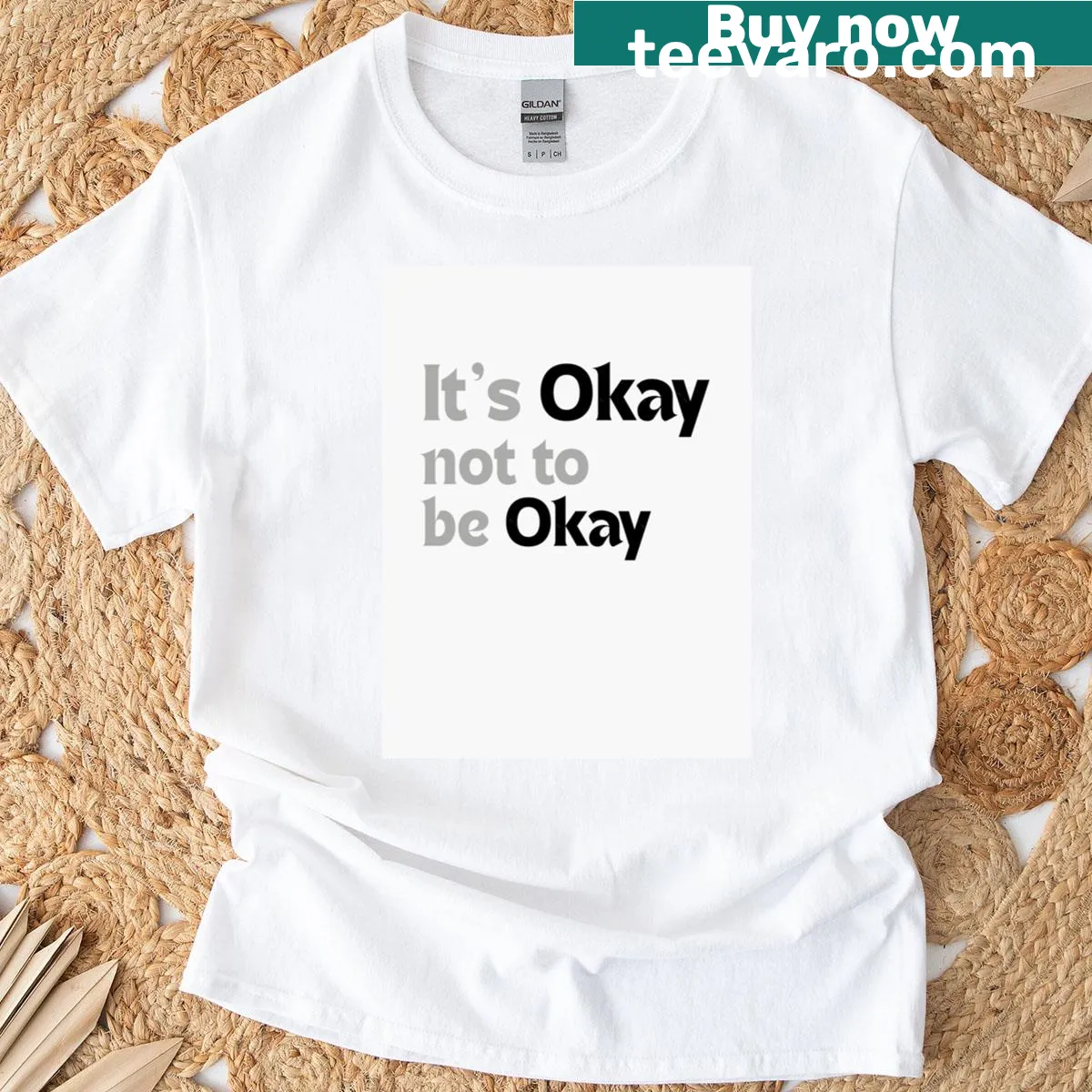 T-shirt featuring the phrase 'It's Okay Not To Be Okay' in simple typography — on a men's t-shirt