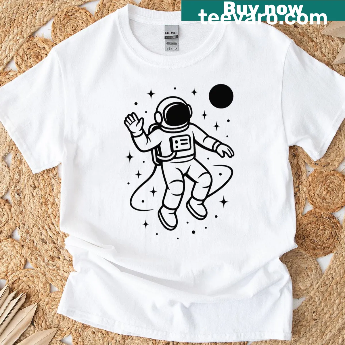 Monochrome astronaut illustration on a space-themed T-shirt — on a men's t-shirt